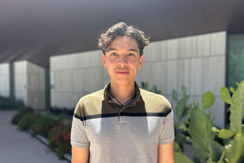 Angel Palazuelos smiling outside of Helios Education Campus in Phoenix